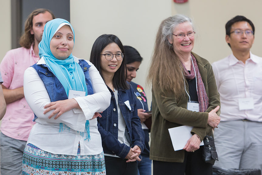 Betty Chewning standing with students