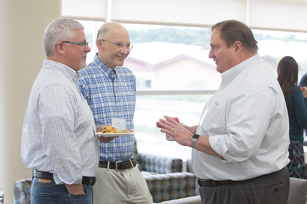 Dean Steve Swanson speaking with staff