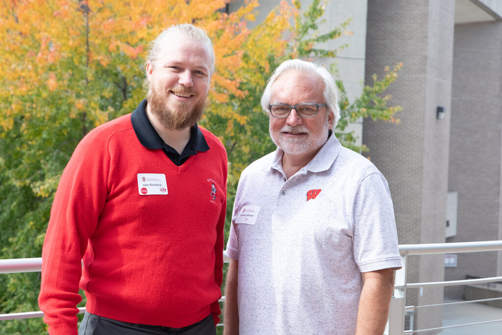 Jeffrey Johnson smiling with Kyle Kleinbeck