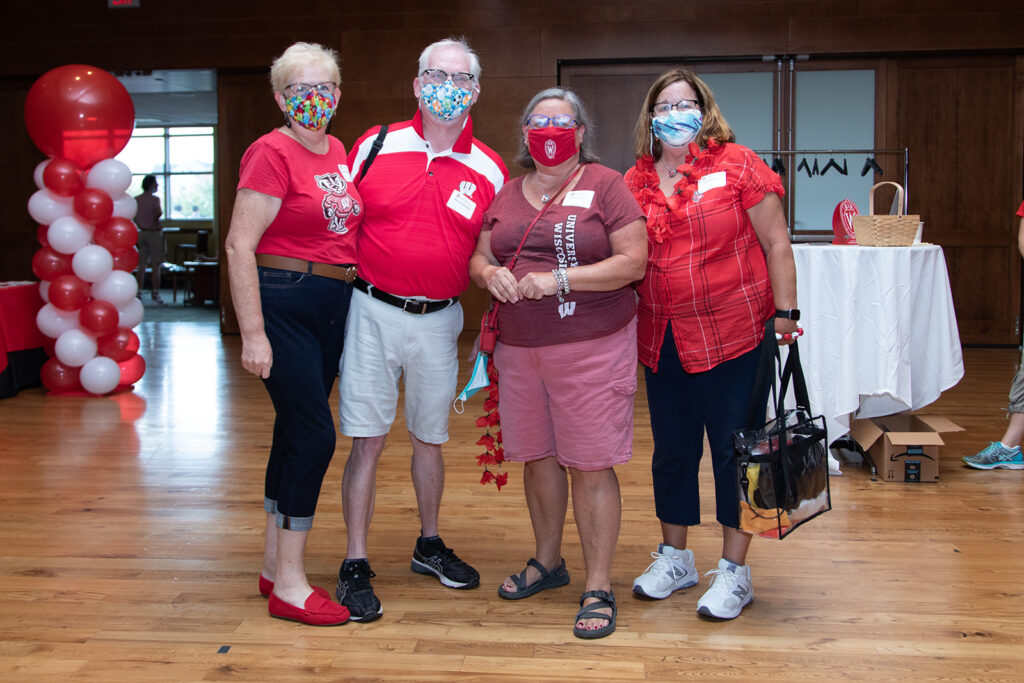 Pharmacy alumni wearing red together at event