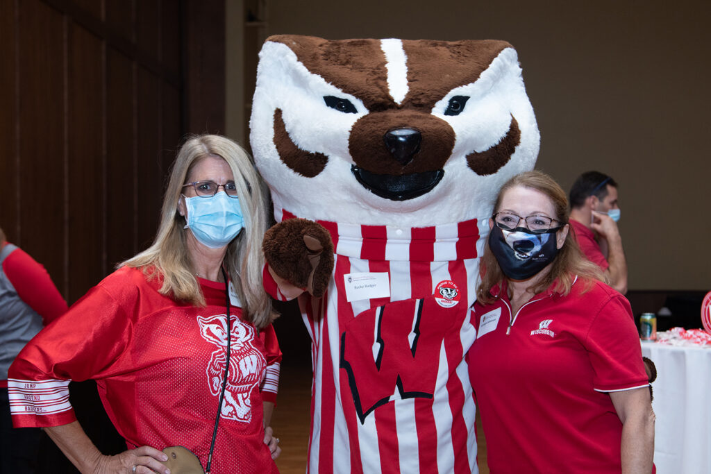 Bucky Badger with event coordinators