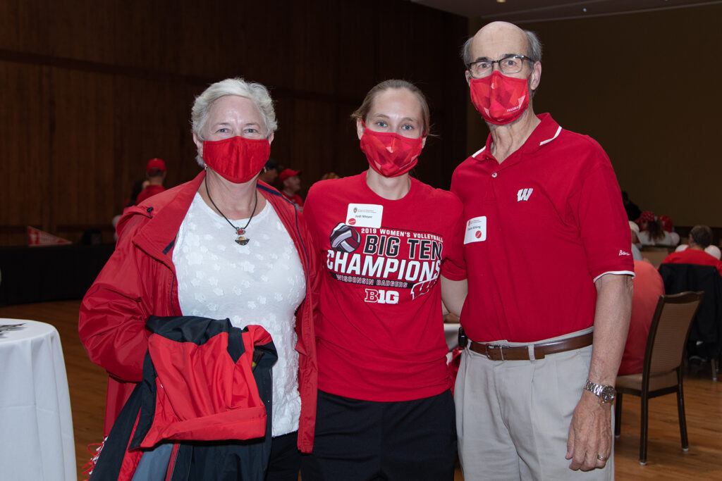 Alumni event coordinators and attendees standing together