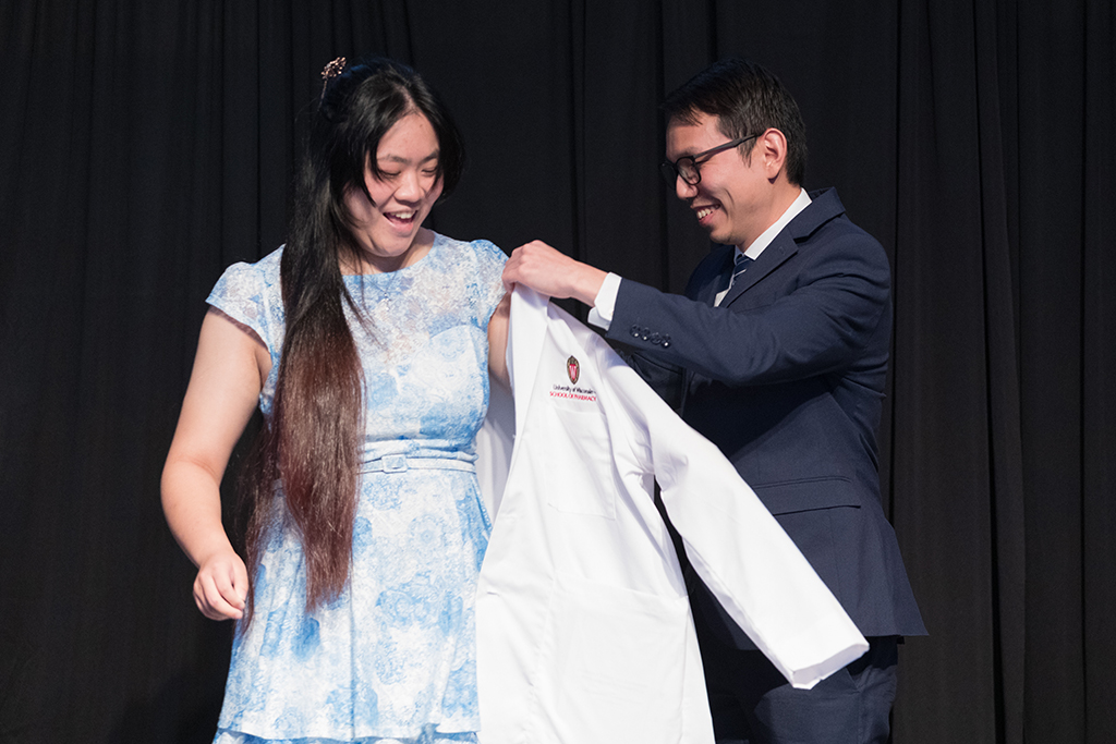 A student receives a white coat during the 2022 White Coat Ceremony.