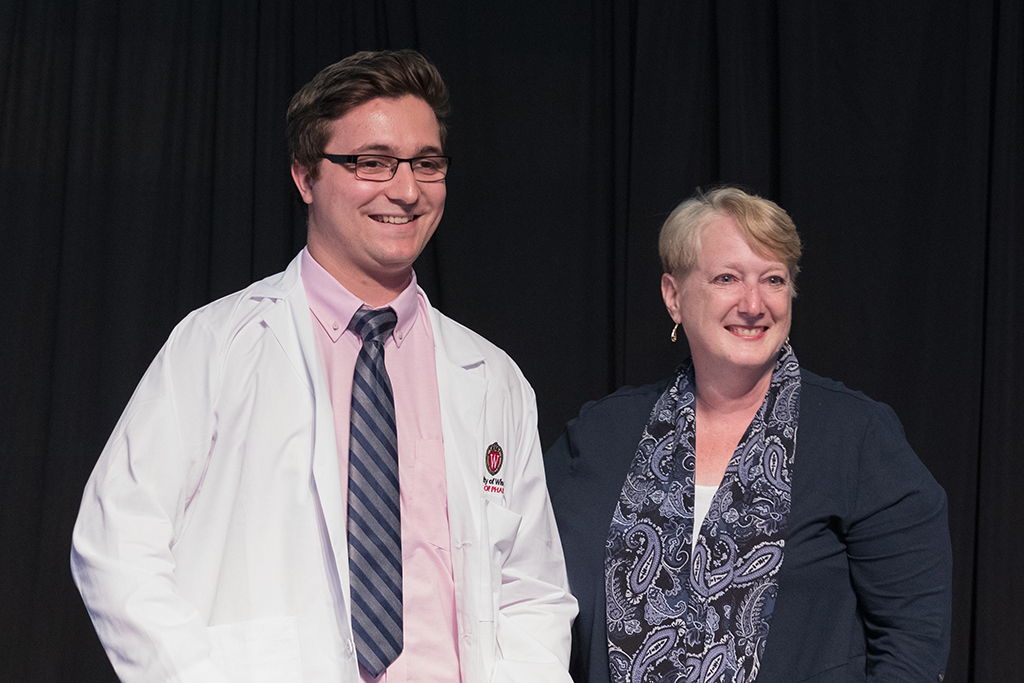 A student receives a white coat during the 2022 White Coat Ceremony.