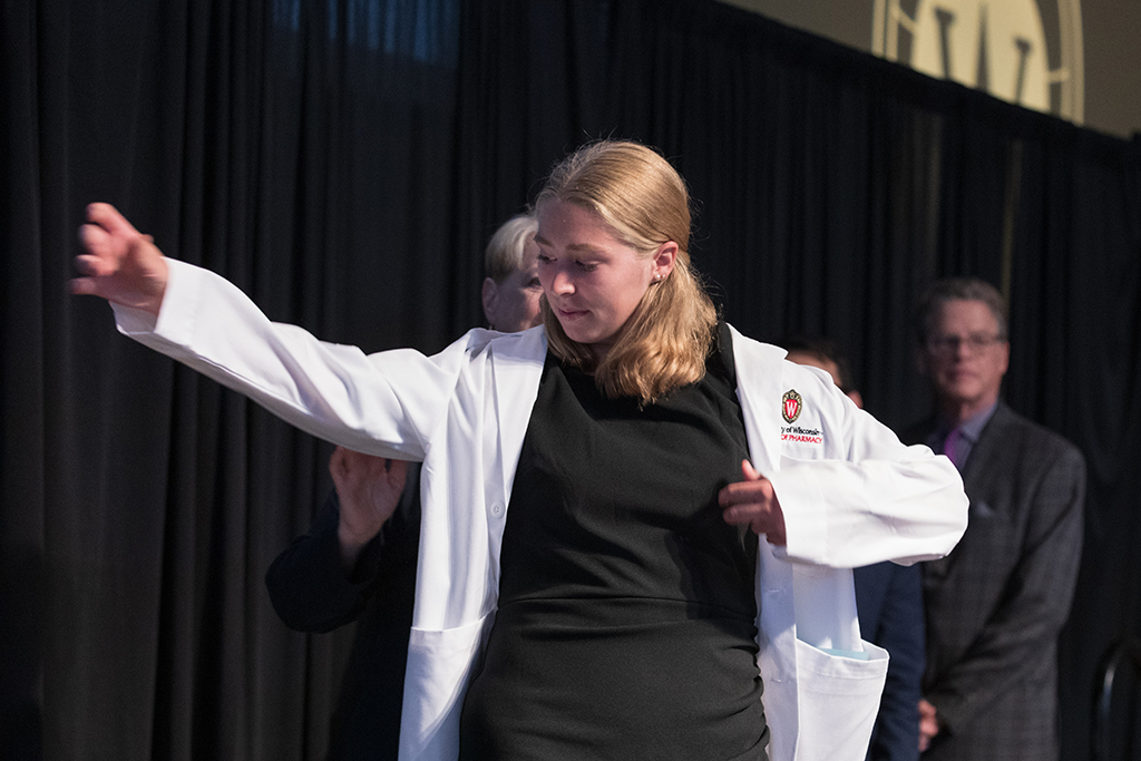 A student receives a white coat during the 2022 White Coat Ceremony.