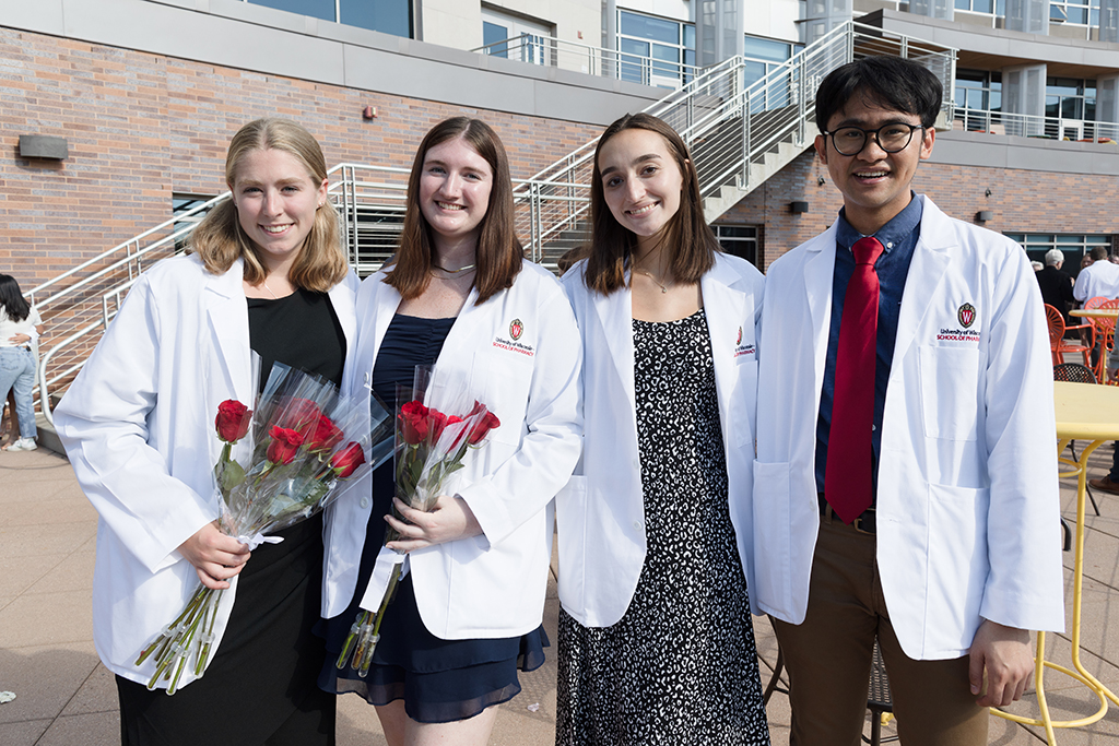 A group of students pose outside after the 2022 White Coat Ceremony.