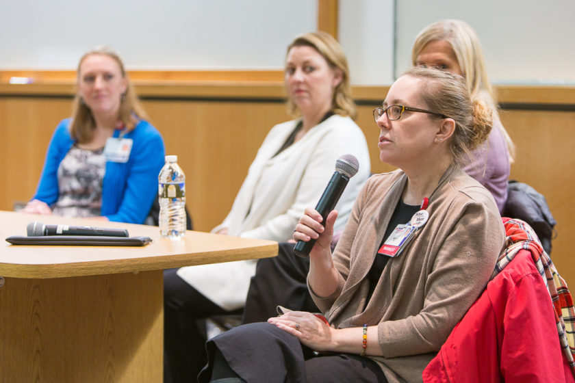 Pharmacist speaking into microphone during career development day