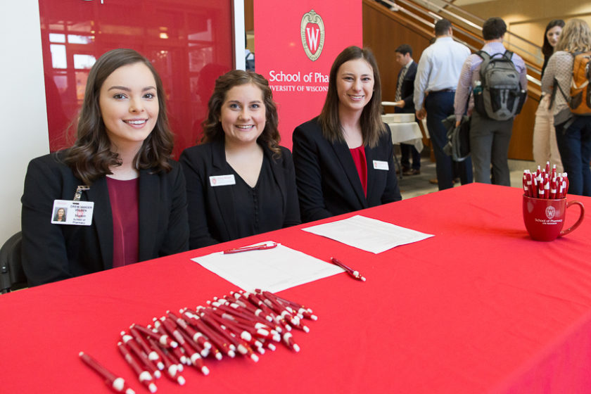Staff sitting down at check-in booth