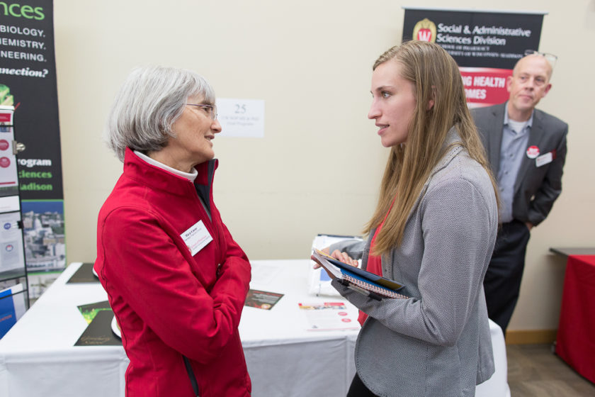 Student speaking to staff at Career development day