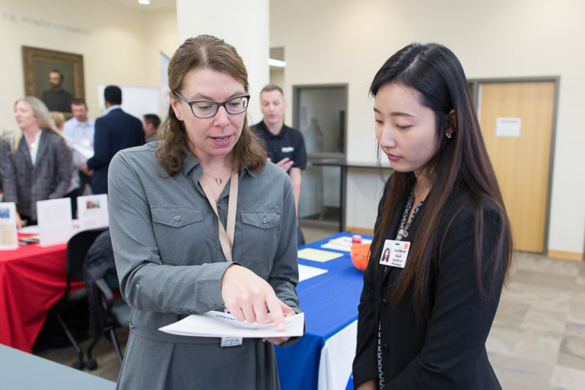 Student speaking to staff at Career development day