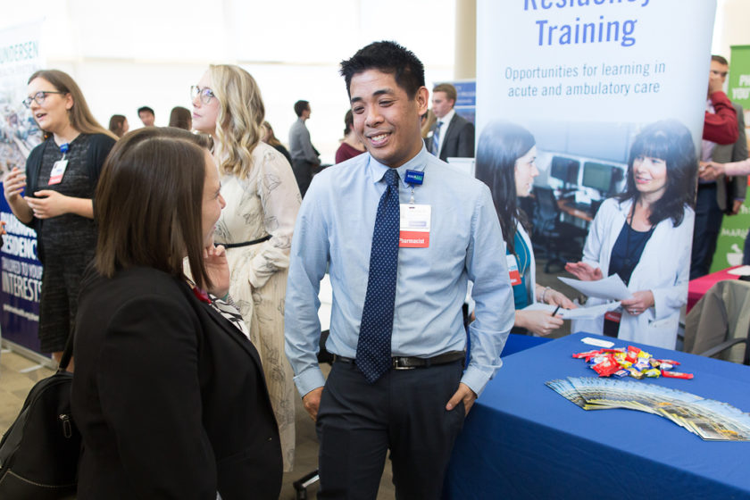 Student speaking to staff at Career development day
