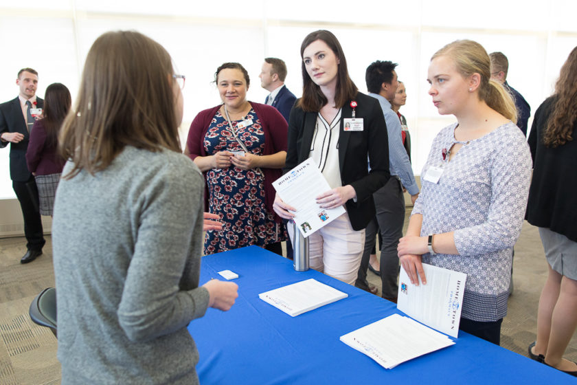 Students speaking to staff at Career development day