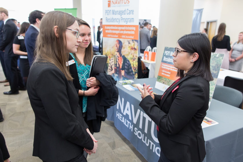 Students speaking to staff at Career development day