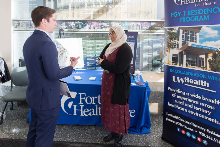 Student speaking to staff at Career development day