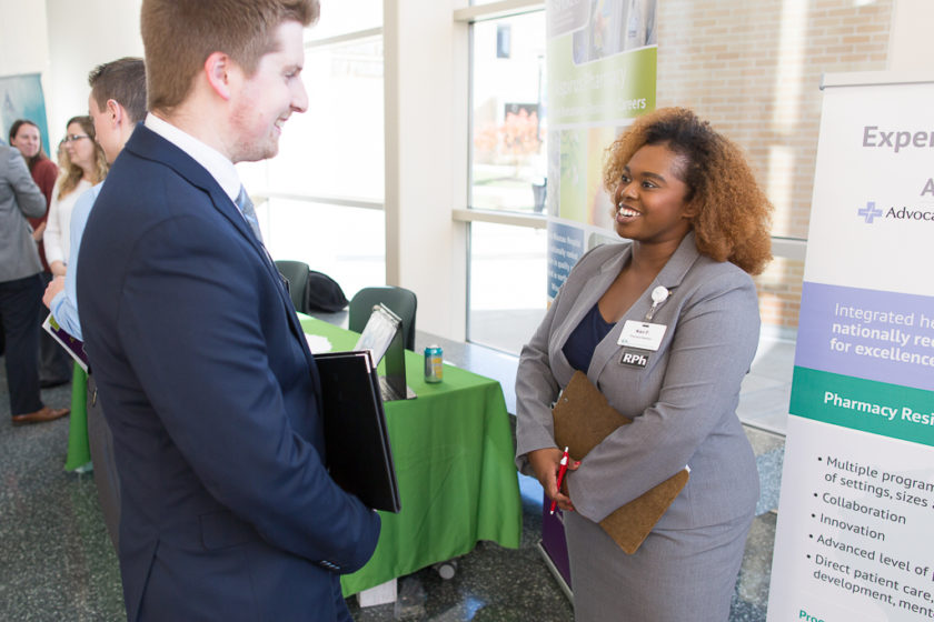 Student speaking to staff at Career development day
