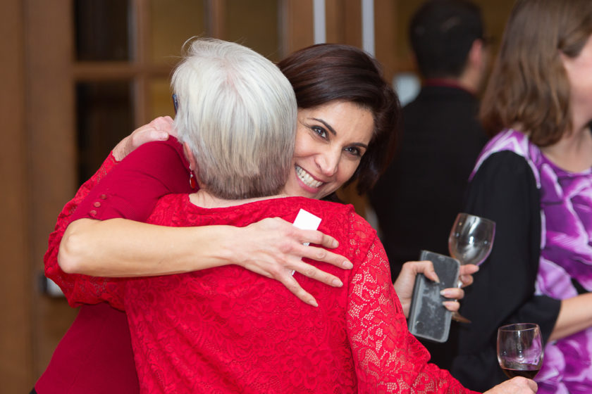 Staff hugging at Citations of merit dinner