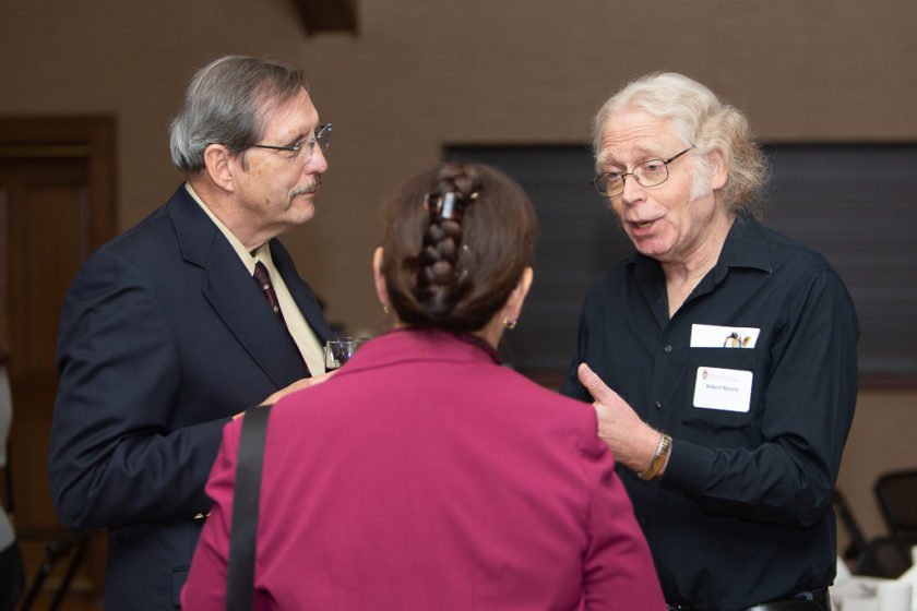 Staff talking at Citations of merit dinner