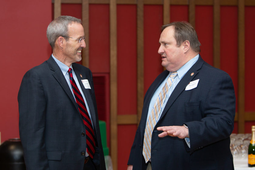 Dean Steve Swanson and Dave Mott talking together at Citations of Merit dinner