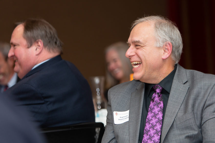 Staff laughing at Citations of merit dinner