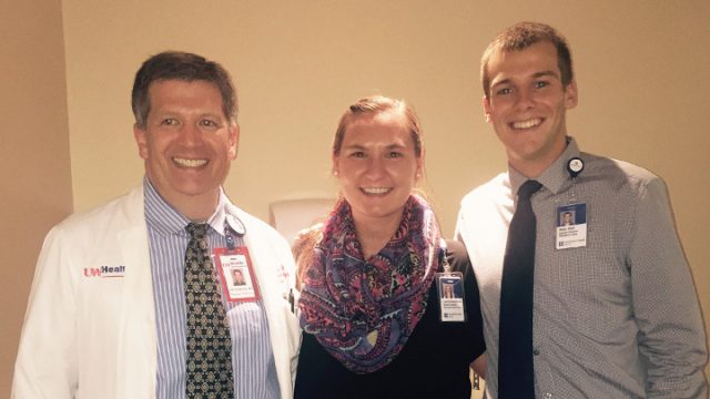 Dr. Patrick Dowling, Laura Josephson, and Alex Hall standing together smiling