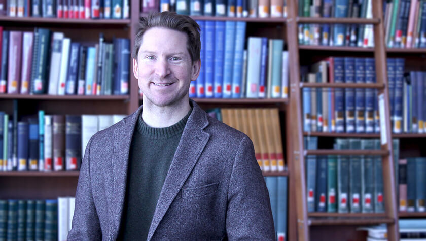 portrait of Lucas Richert, associate professor in the School's Social and Administrative Sciences Division