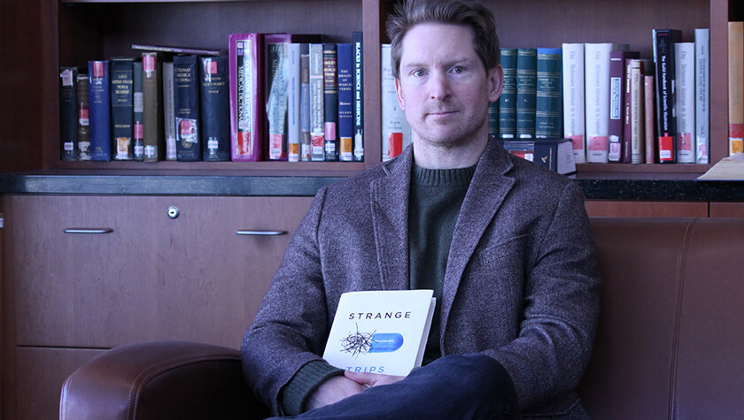 Associate Professor Lucas Richert and his new book, Strange Trips.