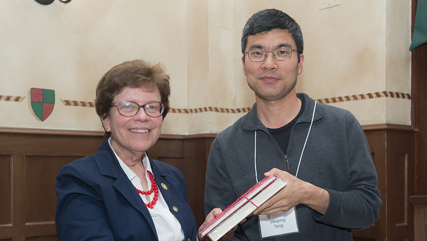 Professor Weiping Tang and Chancellor Rebecca Blank.